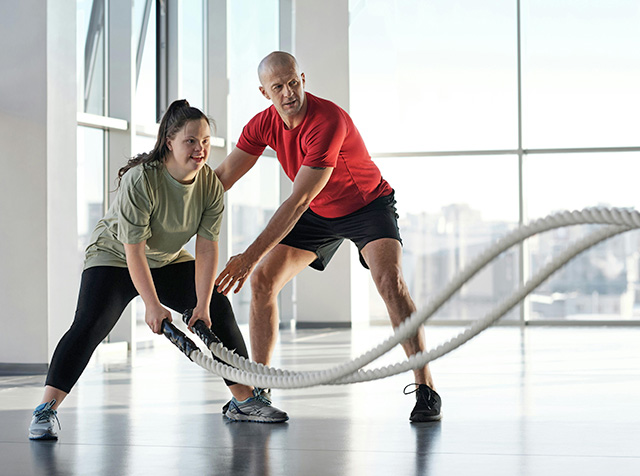 personal trainer helping a client