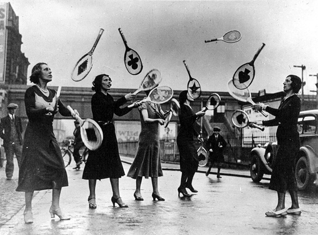 women jugglers with tennis rackets